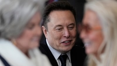 Elon Musk arrives before the 60th Presidential Inauguration in the Rotunda of the U.S. Capitol in Washington, Monday, Jan. 20, 2025. In foreground are Susie Wiles, left and Miriam Adelson. (AP) Elon Musk arrives before the 60th Presidential Inauguration in the Rotunda of the U.S. Capitol in Washington, Monday, Jan. 20, 2025. In foreground are Susie Wiles, left and Miriam Adelson. (AP)