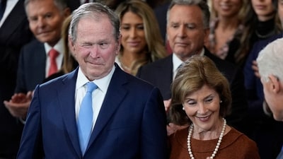 Former US President George W Bush and Laura Bush arrive before the 60th Presidential Inauguration in the Rotunda of the US Capitol in Washington. (AP) Former US President George W Bush and Laura Bush arrive before the 60th Presidential Inauguration in the Rotunda of the US Capitol in Washington. (AP)