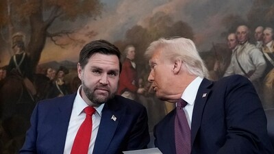 Donald Trump speaks with JD Vance, left, before taking their oaths of office during the Inauguration ceremonies in the Rotunda of the US Capitol. (AP) Donald Trump speaks with JD Vance, left, before taking their oaths of office during the Inauguration ceremonies in the Rotunda of the US Capitol. (AP)