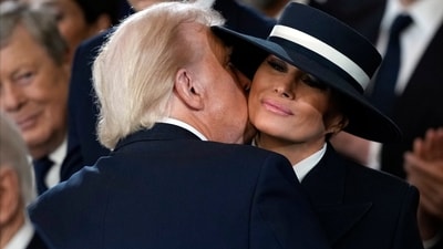 President Donald Trump kisses first lady Melania Trump during his inauguration ceremony. (AP) President Donald Trump kisses first lady Melania Trump during his inauguration ceremony. (AP)
