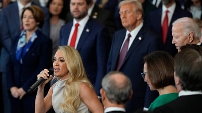 Carrie Underwood performs America the Beautiful during the 60th Presidential Inauguration in the Rotunda of the US Capitol in Washington. President Donald Trump and Vice President JD Vance seen listening in the background. (AP) Carrie Underwood performs America the Beautiful during the 60th Presidential Inauguration in the Rotunda of the US Capitol in Washington. President Donald Trump and Vice President JD Vance seen listening in the background. (AP)