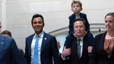 Speaker of the House Mike Johnson walks with Vivek Ramaswamy and Elon Musk, who is carrying his son X Æ A-Xii, as they walk to a meeting to discuss President-elect Donald Trump's planned Department of Government Efficiency, on Capitol Hill in Washington, (AP) Speaker of the House Mike Johnson walks with Vivek Ramaswamy and Elon Musk, who is carrying his son X Æ A-Xii, as they walk to a meeting to discuss President-elect Donald Trump's planned Department of Government Efficiency, on Capitol Hill in Washington, (AP)