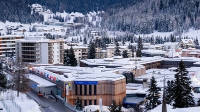 The Davos Congress Center, center, where the World Economic Forum will take place is covered in snow in Davos, Switzerland (AP) The Davos Congress Center, center, where the World Economic Forum will take place is covered in snow in Davos, Switzerland (AP)