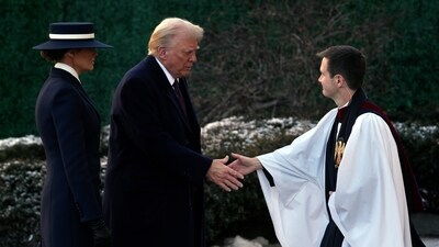 President-elect Donald Trump and his wife Melania are greeted as they arrive for church service at St. John's Episcopal Church across from the White House in Washington. (Matt Rourke/AP) President-elect Donald Trump and his wife Melania are greeted as they arrive for church service at St. John's Episcopal Church across from the White House in Washington. (Matt Rourke/AP)