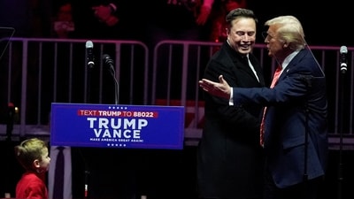 U.S. President-elect Donald Trump greets Tesla CEO and X owner Elon Musk during a rally the day before Trump is scheduled to be inaugurated for a second term, in Washington, U.S., January 19, 2025. (REUTERS)