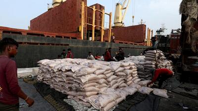 FILE PHOTO: A worker arranges sugar bags in a net to load them onto a cargo ship at the Deendayal Port in Kandla in Gujarat. (REUTERS) FILE PHOTO: A worker arranges sugar bags in a net to load them onto a cargo ship at the Deendayal Port in Kandla in Gujarat. (REUTERS)