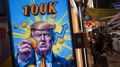 A cartoon image of US President-elect Donald Trump holding a Bitcoin token to mark the cryptocurrency reaching over $100,000 displayed at a Coinhero store in Hong Kong, China, on in Hong Kong, China, on Thursday, Dec. 5, 2024. (Justin Chin/Bloomberg) A cartoon image of US President-elect Donald Trump holding a Bitcoin token to mark the cryptocurrency reaching over $100,000 displayed at a Coinhero store in Hong Kong, China, on in Hong Kong, China, on Thursday, Dec. 5, 2024. (Justin Chin/Bloomberg)