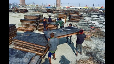 Labourers clean the charred remains of the tents at the spot where a fire broke out on Jan 19 during the ongoing Mahakumbh 2025, at Sangam in Prayagraj on Monday. (Anand Prashad/ANI) Labourers clean the charred remains of the tents at the spot where a fire broke out on Jan 19 during the ongoing Mahakumbh 2025, at Sangam in Prayagraj on Monday. (Anand Prashad/ANI)