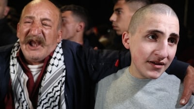 Palestinian prisoner Mawaad al-Haj (R), who was released from jail in a previous exchange in late 2023 and then imprisoned another time, stands next to his father upon the arrival of some 90 prisoners set free by Israel in the early hours of January 20, 2025 in the occupied West Bank town of Beitunia, on the outskirts of Ramallah. (AFP) Palestinian prisoner Mawaad al-Haj (R), who was released from jail in a previous exchange in late 2023 and then imprisoned another time, stands next to his father upon the arrival of some 90 prisoners set free by Israel in the early hours of January 20, 2025 in the occupied West Bank town of Beitunia, on the outskirts of Ramallah. (AFP)