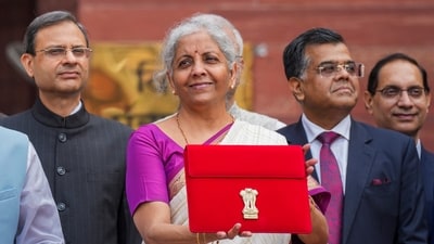 Union Finance Minister Nirmala Sitharaman displays a red pouch carrying the Budget documents outside the Finance Ministry in North Block before leaving for the Parliament where she will table the Union Budget 2024-25, in New Delhi, (File image) (PTI) Union Finance Minister Nirmala Sitharaman displays a red pouch carrying the Budget documents outside the Finance Ministry in North Block before leaving for the Parliament where she will table the Union Budget 2024-25, in New Delhi, (File image) (PTI)