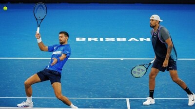 Nick Kyrgios (R) watches as Novak Djokovic (L) hit a return during their men's doubles match against Alexander Erler and Andreas Mies at the Brisbane International. (AFP) Nick Kyrgios (R) watches as Novak Djokovic (L) hit a return during their men's doubles match against Alexander Erler and Andreas Mies at the Brisbane International. (AFP)