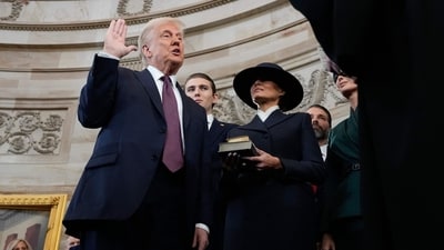 Donald Trump is sworn in as the 47th president of the United States by Chief Justice John Roberts as Melania Trump holds the Bible. (AFP) Donald Trump is sworn in as the 47th president of the United States by Chief Justice John Roberts as Melania Trump holds the Bible. (AFP)