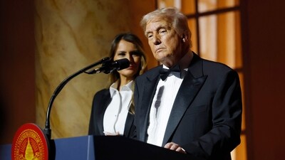 US President-elect Donald Trump gives remarks alongside Melania Trump at a candlelight dinner at the National Building Museum on Sunday. (AFP)