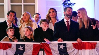 Tiffany Trump attended the event with her husband, Michael Boulos, wearing a striking black sweetheart neckline dress, while Eric Trump and his wife, Lara, also made an appearance. On Friday, Donald Trump Jr. and his partner, Bettina Anderson, were spotted at the Crypto Ball in Washington, D.C. Donning a patriotic look, he wore a tuxedo, accentuated by American flag cufflinks and dress shirt buttons emblazoned with ‘MAGA,’ showcasing his unwavering support for his father’s legacy. (Photo by Jim WATSON / AFP) (AFP) Tiffany Trump attended the event with her husband, Michael Boulos, wearing a striking black sweetheart neckline dress, while Eric Trump and his wife, Lara, also made an appearance. On Friday, Donald Trump Jr. and his partner, Bettina Anderson, were spotted at the Crypto Ball in Washington, D.C. Donning a patriotic look, he wore a tuxedo, accentuated by American flag cufflinks and dress shirt buttons emblazoned with ‘MAGA,’ showcasing his unwavering support for his father’s legacy. (Photo by Jim WATSON / AFP) (AFP)