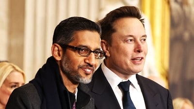 WASHINGTON, DC - JANUARY 20: CEO of Google Sundar Pichai (L) and Tesla, SpaceX and X CEO Elon Musk attend the inauguration of U.S. President-elect Donald Trump in the Rotunda of the U.S. Capitol on January 20, 2025 in Washington, DC. Donald Trump takes office for his second term as the 47th president of the United States. Chip Somodevilla/Getty Images/AFP (Photo by CHIP SOMODEVILLA / GETTY IMAGES NORTH AMERICA / Getty Images via AFP) (Getty Images via AFP) WASHINGTON, DC - JANUARY 20: CEO of Google Sundar Pichai (L) and Tesla, SpaceX and X CEO Elon Musk attend the inauguration of U.S. President-elect Donald Trump in the Rotunda of the U.S. Capitol on January 20, 2025 in Washington, DC. Donald Trump takes office for his second term as the 47th president of the United States. Chip Somodevilla/Getty Images/AFP (Photo by CHIP SOMODEVILLA / GETTY IMAGES NORTH AMERICA / Getty Images via AFP) (Getty Images via AFP)