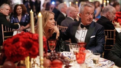 The incoming Secretary of Health and Human Services, Robert F. Kennedy Jr., attended the Vice President’s Dinner in a sharp navy and black lapel jacket, paired with a white tuxedo shirt featuring black piping, and completed with a bow tie and white pocket square. His wife, actress Cheryl Hines, looked stunning in an off-the-shoulder black dress adorned with elegant feather detailing, adding a touch of glamour to the evening’s high-profile event. Eric Thayer/Getty Images/AFP (Photo by Eric Thayer / GETTY IMAGES NORTH AMERICA / Getty Images via AFP) (Getty Images via AFP) The incoming Secretary of Health and Human Services, Robert F. Kennedy Jr., attended the Vice President’s Dinner in a sharp navy and black lapel jacket, paired with a white tuxedo shirt featuring black piping, and completed with a bow tie and white pocket square. His wife, actress Cheryl Hines, looked stunning in an off-the-shoulder black dress adorned with elegant feather detailing, adding a touch of glamour to the evening’s high-profile event. Eric Thayer/Getty Images/AFP (Photo by Eric Thayer / GETTY IMAGES NORTH AMERICA / Getty Images via AFP) (Getty Images via AFP)