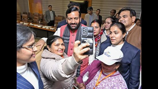 Haryana chief minister Nayab Singh Saini posing for selfies after the sixth pre-budget consultation with women for Budget 2025-26 held in Panchkula on Monday. (Nayab Saini/X)