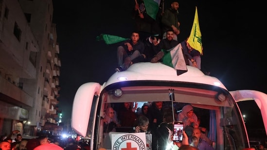 It is unclear if the violence will return after the first phase, but negotiations for the second, more challenging phase are set to start in less than two weeks. In pic: Crowds cheered, chanted and honked car horns as two buses carrying the prisoners arrived in Beitunia following their release as part of the Gaza ceasefire deal that began on January 19 and saw three Israeli hostages freed by Hamas in the Gaza Strip.(AFP)