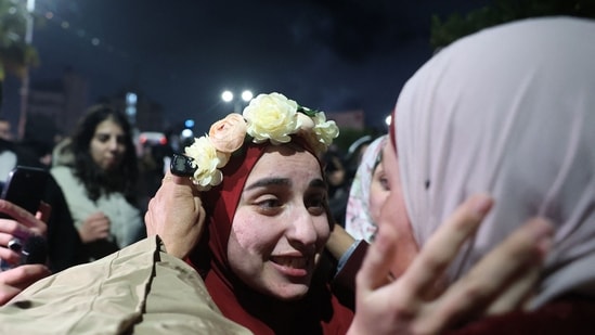 Humanitarian groups are stepping up their efforts to redress the massive devastation left by the conflict in Gaza as Israel starts to reduce its military presence there. In pic: a Palestinian prisoner is welcomed by a relative upon the arrival of some 90 prisoners set free by Israel in the early hours of January 20, 2025 in the occupied West Bank town of Beitunia, on the outskirts of Ramallah.&nbsp;(AFP)