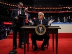 The US President Donald Trump gestures on the day he signs the freedom of speech executive order during the inaugural parade inside Capital One Arena on the inauguration day of his second presidential term, in Washington.