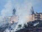 Firefighters tackle the Friars Fire, a blaze that broke out near the Fashion Valley Mall in San Diego, California.