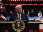 U.S. President Donald Trump gestures as he signs an executive order during the inaugural parade inside Capital One Arena on the inauguration day of his second presidential term, in Washington, U.S. January 20, 2025. REUTERS/Carlos Barria