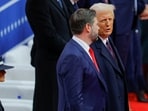US President Donald Trump and US Vice President JD Vance speak in front of first lady Melania Trump during a rally on the inauguration day of his second Presidential term, inside Capital One, in Washington, US January 20, 