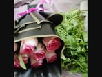 The woman shared a photo of the pink roses with the coriander leaves she received from Swiggy. The woman shared a photo of the pink roses with the coriander leaves she received from Swiggy.