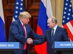 US President Donald Trump (L) and Russia's President Vladimir Putin shake hands before attending a joint press conference. (File image/AFP)