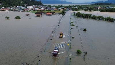 A drone view shows vehicles driving in an area flooded after heavy rains, in Tijucas, in Santa Catarina state, Brazil January 17, 2025. REUTERS/Anderson Coelho (REUTERS)