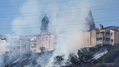 Firefighters tackle the Friars Fire, a blaze that broke out near the Fashion Valley Mall in San Diego, California. (REUTERS)