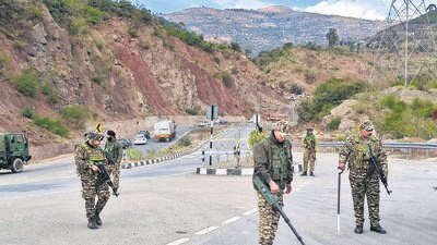 CRPF personnel conduct security checks as security heightens ahead of Republic Day celebrations, at Jammu Srinagar National Highway in Samroli on Tuesday. (ANI) CRPF personnel conduct security checks as security heightens ahead of Republic Day celebrations, at Jammu Srinagar National Highway in Samroli on Tuesday. (ANI)
