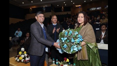 Chief guest Amrapalli Das, IRS, principal chief commissioner, income tax, NWR Chandigarh, being welcomed at the Post Graduate Government College for Girls, Sector 42. (HT Photo)