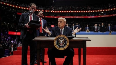 US President Donald Trump gestures on the day he signs the freedom of speech executive order during the inaugural parade inside Capital One Arena on the inauguration day of his second presidential term in Washington on January 20, 2025. (Reuters)