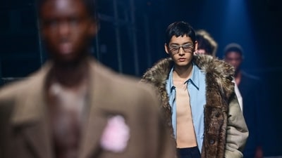 A model walks the runway during the Prada collection show at Milan's Fashion Week Men's Fall / Winter 2025-2026. (AFP) A model walks the runway during the Prada collection show at Milan's Fashion Week Men's Fall / Winter 2025-2026. (AFP)