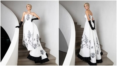 Ivanka's strapless number featured a snatched bodice, a cinched waist, a floating bustle train over a pencil skirt, a low V-line in the back, a lovely black ruffle attached to the hem of the train, and meticulously hand-embroidered delicate black pearl floral motifs. Ivanka's strapless number featured a snatched bodice, a cinched waist, a floating bustle train over a pencil skirt, a low V-line in the back, a lovely black ruffle attached to the hem of the train, and meticulously hand-embroidered delicate black pearl floral motifs. 