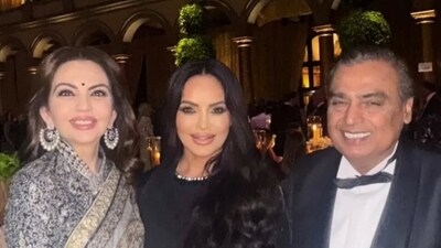 Nita Ambani with Mukesh Ambani and a guest at Trump's pre-inauguration bash. Nita Ambani with Mukesh Ambani and a guest at Trump's pre-inauguration bash.