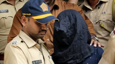 Police personnel take the accused, arrested in connection with the alleged attack on Bollywood actor Saif Ali Khan, to a hospital for medical examination before producing him at a court, in Mumbai. (PTI) Police personnel take the accused, arrested in connection with the alleged attack on Bollywood actor Saif Ali Khan, to a hospital for medical examination before producing him at a court, in Mumbai. (PTI)