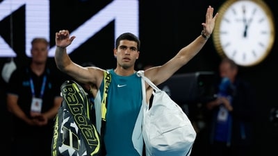 Spain's Carlos Alcaraz reacts and acknowledges the Melbourne crowd after losing his quarter final match against Serbia's Novak Djokovic. (REUTERS)