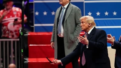 US President Donald Trump tossed the signing pens/markers into the crowd after signing executive orders during his presidential inauguration parade. (Bloomberg) US President Donald Trump tossed the signing pens/markers into the crowd after signing executive orders during his presidential inauguration parade. (Bloomberg)