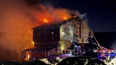 Firefighters work to extinguish a fire at a hotel in the ski resort of Kartalkaya in Bolu province, Turkey. (via REUTERS)