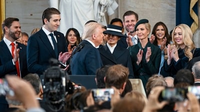 President Donald Trump, center, reacts after he is sworn in as Vice President JD Vance, from left, Barron Trump, Melania Trump, Ivanka Trump and Tiffany Trump watch at the 60th Presidential Inauguration in the Rotunda of the US Capitol in Washington on Monday. Inauguration day was all about pomp and pageantry. Take a look at all the fashion. (AP) President Donald Trump, center, reacts after he is sworn in as Vice President JD Vance, from left, Barron Trump, Melania Trump, Ivanka Trump and Tiffany Trump watch at the 60th Presidential Inauguration in the Rotunda of the US Capitol in Washington on Monday. Inauguration day was all about pomp and pageantry. Take a look at all the fashion. (AP)