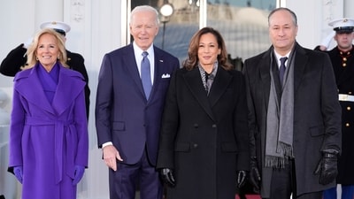 President Joe Biden and first lady Jill Biden greet Vice President Kamala Harris and second gentleman Doug Emhoff upon their arrival at the White House. Former US vice president Kamala chose a strong and elegant all-black look on Monday. She dressed in head-to-toe black: a black overcoat, black trousers, and black pointed-toe pumps. A black-and-white illustrated scarf tied at her neck added slight contrast to the otherwise monochromatic look. (AP) President Joe Biden and first lady Jill Biden greet Vice President Kamala Harris and second gentleman Doug Emhoff upon their arrival at the White House. Former US vice president Kamala chose a strong and elegant all-black look on Monday. She dressed in head-to-toe black: a black overcoat, black trousers, and black pointed-toe pumps. A black-and-white illustrated scarf tied at her neck added slight contrast to the otherwise monochromatic look. (AP)