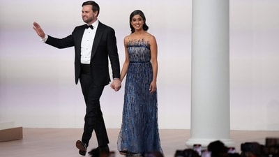 Usha Vance chose a blue strapless gown as she arrived with Trump's second-in-command, JD Vance, at the Commander-in-Chief Ball. Usha's floor-length dress features a sheer mesh neckline that gives the illusion of a strapless design, glittering blue sequin embellishments, a cinched waistline, and a flowy layered tulle skirt. (Getty Images via AFP) Usha Vance chose a blue strapless gown as she arrived with Trump's second-in-command, JD Vance, at the Commander-in-Chief Ball. Usha's floor-length dress features a sheer mesh neckline that gives the illusion of a strapless design, glittering blue sequin embellishments, a cinched waistline, and a flowy layered tulle skirt. (Getty Images via AFP)