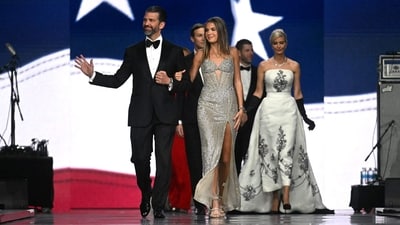 Donald Trump Jr arrived with his daughter, Kai Madison Trump, at the Liberty inaugural ball in Washington. While he wore a black tuxedo, his daughter chose a silver Sherri Hill gown. (AFP) Donald Trump Jr arrived with his daughter, Kai Madison Trump, at the Liberty inaugural ball in Washington. While he wore a black tuxedo, his daughter chose a silver Sherri Hill gown. (AFP)