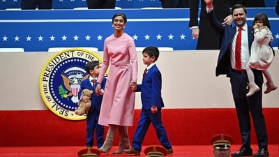 US Vice President JD Vance (R), US Second Lady Usha Vance and their children walk on stage as they arrive the inaugural parade inside Capital One Arena, in Washington DC. Usha attended the 2025 inauguration in a pink Oscar de la Renta coat dress, marking her debut in the outfit as second lady of the US. (AFP) US Vice President JD Vance (R), US Second Lady Usha Vance and their children walk on stage as they arrive the inaugural parade inside Capital One Arena, in Washington DC. Usha attended the 2025 inauguration in a pink Oscar de la Renta coat dress, marking her debut in the outfit as second lady of the US. (AFP)