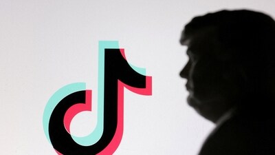 A 3D-printed miniature model of US President Donald Trump and TikTok logo are seen in this illustration. (REUTERS)
