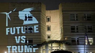 A view shows a protest projection set up by Greenpeace activists onto the wall of the U.S. Embassy in Berlin against Trump's withdrawal from the Paris Climate Agreement, in Berlin, Germany January 21. (REUTERS)