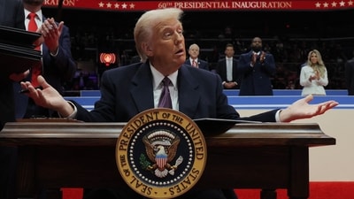 U.S. President Donald Trump gestures as he signs an executive order during the inaugural parade inside Capital One Arena on the inauguration day of his second presidential term, in Washington, U.S. January 20, 2025. REUTERS/Carlos Barria (REUTERS)