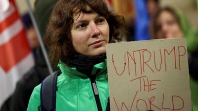 “UnTrump the World”, reads a woman's placard as protests against Donald Trump took place in Belgium's Brussels as well. On January 20, trade unions, social movement organisations, feminists and anti-racist activists protested against Trump's agenda, which they reportedly describe as a "far-right programme serving American billionaires" (Reuters)